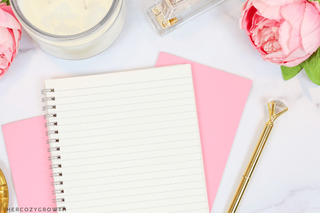 Self-care ritual with candle and journal supporting mindful habits for personal growth.